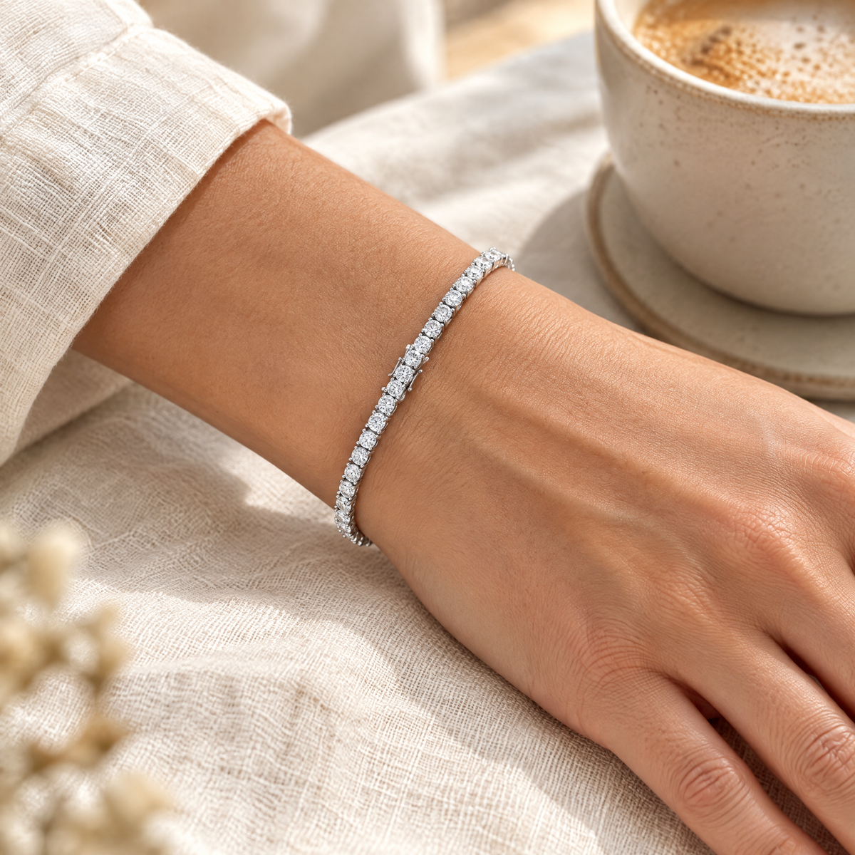 Moissanite tennis bracelet in sterling silver worn on the wrist